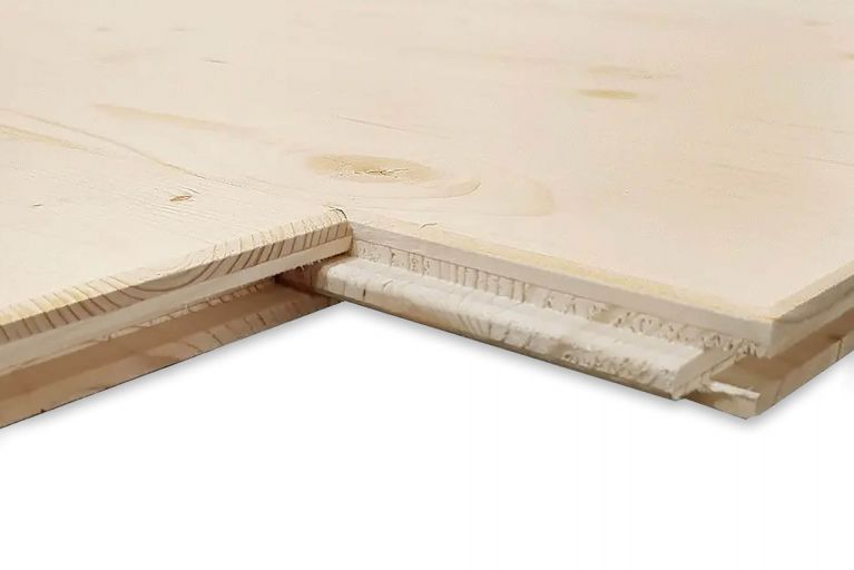 Zwei naturfarbene Holzplatten mit Nut-und-Feder-Verbindung liegen übereinander.